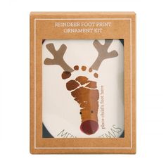 the reindeer foot print ornament kit is packaged in a cardboard box with brown trim