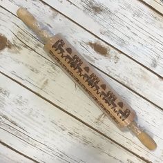 a wooden stick with some writing on it