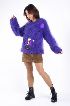 SIZE: M. COLOR: purple. MATERIAL: 75% Mohair, 10% virgin wool, 15% acrylic. FEATURES: if you're looking for a statement funky piece to add to your winter wardrobe, this cozy high quality women's wool-blend sweater with clown and ballons patchwork is exactly what you need! Made in Italy from a hairy kid mohair wool fabric, this bright purple sweater will keep you super warm through the colder months. A crew neckline falls into long puffy sleeves and an overall slouchy bodice. Made in Italy. CONDI Winter Purple Acrylic Sweater, Playful Fitted Winter Sweater, Playful Fitted Sweater For Winter, Purple Wool Sweater For Winter, Purple Wool Winter Sweater, Purple Mohair Sweater For Fall, Long Puffy Sleeves, Shirt Cuff, Mohair Wool