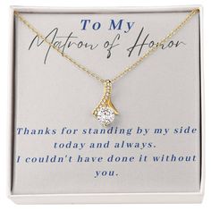 To My Matron of HonorThanks for standing by my side today and always. I couldn't have done it without you.Imagine her reaction when she opens this stunning gift! The Alluring Beauty necklace features a petite ribbon shaped pendant that is sure to dazzle your special someone. Whether it's a birthday or anniversary, make sure to get her a gift she will love for years to come. 14k white gold finish or 18k yellow gold finish over stainless steel 7mm cubic zirconia Pendant dimensions: 0.8" (20mm) height / 0.4" (10mm) width Adjustable length: 18" - 22" (45.72 cm - 55.88 cm) Lobster clasp Your piece is lovingly packaged in a complimentary soft touch box for easy gifting. Elevate your presentation by upgrading to the mahogany style luxury box, which features a brilliant LED spotlight. Matron Of Honor Gifts, Matron Of Honor, Beauty Necklace, Matron Of Honour, Led Spotlight, Luxury Boxes, My Side, Stand By Me, Wedding Stuff