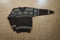 Vintage 1980s Nornitter Norwegian Wool Jumper - Hand-Knitted in Rustic Wool. This authentic Nordic wool sweater features traditional Scandinavian colorwork patterns in versatile shades of brown and cream. A true gem from the North, it's in very good vintage condition with only minor signs of wear that add to its rustic charm. Ideal for both men and women, it fits men's size S/M and women's size M/L. Measurements (laid flat, on one side): -Armpit to Armpit: 53 cm / 21 inches -Length: 72 cm / 28 1/3 inches Vintage Winter Knitted Patterns, Vintage Knitted Patterns For Winter, Fitted Brown Jacquard Knit Sweater, Brown Fitted Jacquard Knit Sweater, Casual Brown Fair Isle Pattern Sweater, Nordic Brown Jacquard Knit Sweater, Brown Nordic Jacquard Knit Sweater, Brown Nordic Sweater For Fall, Retro Brown Crew Neck Sweater