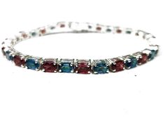 London Blue Topaz Garnet Bracelet Silver Tennis Bracelet Red Blue Bracelet November January Birthstone Bracelet Bridal Gift Anniversary Gift ✤Description :      Metal             : 925 Sterling Silver    Gemstone     : Natural London Blue Topaz , Natural Garnet    Gemstone Size  : 4x6 mm Oval    Gemstone Weight : 20-28 Carats    Length               :  6-9 inches (contact if you want to change it)    Finishing          : Nickel Free Rhodium Plating Anti Tarnishing ✤How to wear it...? You can wear it in any occasions you can clean it with any soft cloth to make it shine last longer & avoid chemicals to clean it. ✤Shipping : We will ship it via DHL Ecommerce , TPL , UPS , etc. that will take around 2-3 weeks. ✤Custom Order  We love to accept Custom Order so feel free to throw us anything ✤No Silver Tennis Bracelet, Garnet Bracelet, Birthstone Bracelet, Wedding Jewelry Bracelets, Bridal Gift, January Birthstone, Birthstone Bracelets, Fine Jewelry Designers, Garnet Gemstone