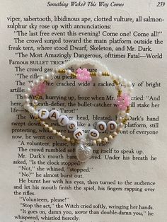 a book page with beads and letters on it