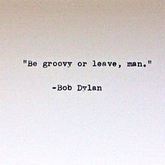 an old typewriter with the words be groovy or leave, man bob dylan