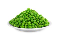 a white bowl filled with peas on top of a table