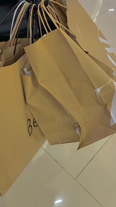 brown paper bags with writing on them sitting on the floor