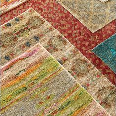 several different colored rugs are arranged together