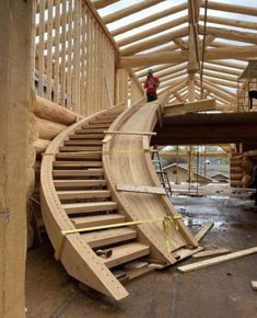 a wooden staircase being built in a building