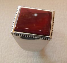 Rectangular silver aqeeq flat natural semi precious agate carnelian gemstone men ring sterling silver 925 jewelry all sizes fast shipping Risk free Quality guarantee policy : If you are not satisfied with your item for any reason simply send it to us and you will get a replacement or refund . please write or choose your size with the order and we will size it for you . Our ring is handcrafted mostly with a few simple tools . but some methods are used in casting like lost wax method . sterling si Modern Carnelian Gemstone Jewelry, Silver Carnelian Ring Jewelry, Silver Carnelian Rings For Gift, Silver Carnelian Ring As A Gift, Modern Carnelian Jewelry With Polished Finish, Modern Chalcedony Jewelry With Polished Finish, Silver Carnelian Rings With Polished Finish, Modern Carnelian Jewelry For Formal Occasions, Silver Rings With Polished Carnelian