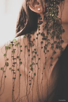 ivy growing on the back of a woman's body