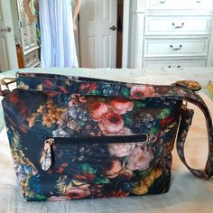 Vintage Floral Large Multiple Compartment Crossbody/Shoulder Bag Nwot Vintage Spacious Floral Flower Print With Roomy Black Interior Lining. Sturdy Goldtone Hardware, Detailed Tags, Print Is Also Inside Of Belt Top Zipper Closure ## Casual, Daytime, Adjustable Straps, Career, Church Belt Top, Floral Flower, Black Interior, Flower Print, Crossbody Shoulder Bag, Flower Prints, Vintage Floral, Pink Blue, Pink Ladies