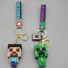 two key chains with different colored pixeles on them