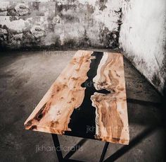 a wooden table with black and white lines on the top in an old room,