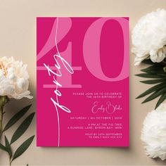 a pink and white wedding card with the number forty on it, next to flowers