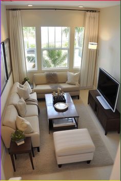 a living room filled with furniture and a flat screen tv