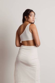 Lexi Ivory Knot Cutout Asymmetric Midi Dress - $45 | Tobi US Summer Vacation Outfits, Ivory Dress, Vacation Outfit, Gold Statement Earrings, Ivory Dresses, Mid Length Dresses, White Midi Dress, Vacation Outfits, Strappy Heels