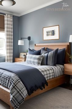 a bedroom with blue walls and plaid bedding