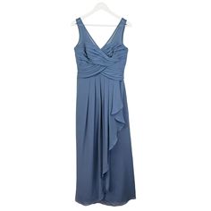 a blue dress hanging on a hanger