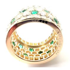 About This Piece: Metal: 18k Yellow Gold Size: European 52, US 6  Weight: 9.8 grams  Width: 13mm  Stones: Round brilliant cut diamonds VVS1 clarity, F-H color And Buff Top emeralds total weight approximately 5.50ct  Hallmarks: Cartier 750 52 627XXX(serial number omitted)   Please refer to the dimensions in the description above for accurate measurements. Please reach out to the seller with any questions on dimensions or fit prior to purchase. Luxury Multi-stone Emerald Ring With Diamonds, Luxury Emerald Ring With Diamond, Luxury Emerald Ring With Pave Setting, Luxury Cubic Zirconia Emerald Ring With Brilliant Cut, Luxury Multi-stone Emerald Cut Emerald Ring, Luxury White Gold Multi-stone Emerald Ring, Luxury Multi-stone Emerald Ring In White Gold, Luxury Gold Emerald Ring With Pave Setting, Luxury Multi-stone Emerald Ring