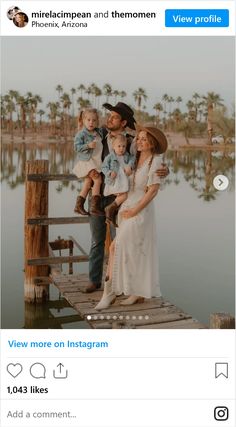 the family is posing for a photo on the dock