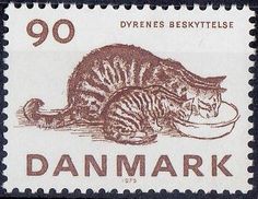 a stamp with a cat eating from a bowl