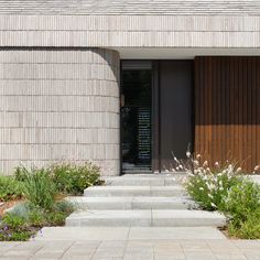 the entrance to a house with steps leading up to it