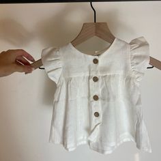 Super Cute, Brand New With Tags White Linen Blouse. Great Quality. Cotton Flutter Sleeve Tops For Playtime, Cotton Tops With Flutter Sleeves For Playtime, Cute Summer Blouse For Playtime, Summer Flutter Sleeve Tops For Playtime, Cute Summer Playtime Blouse, Spring Playwear Tops With Buttons, Spring Playtime Tops With Buttons, White Button Tops For Playtime, White Spring Blouse For Playtime