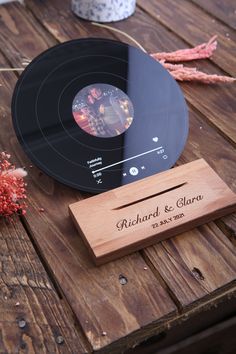 a record player sitting on top of a wooden table