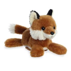 a small stuffed fox sitting on top of a white floor