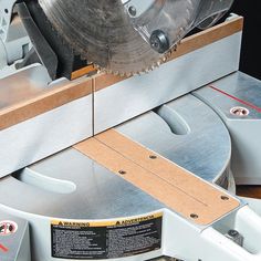 a close up of a circular sawing machine