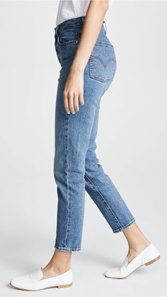 Levi's Everyday Tapered Leg Jeans, Levi's Tapered Leg Jeans For Everyday, Levi's Mid-rise Jeans With Frayed Hem, Levi's Frayed Hem Mid-rise Jeans, Levi's Slim Fit Denim Jeans, Levi's Jeans With Straight Hem For Spring, Fitted Rigid Denim Cropped Jeans Casual, Fitted Rigid Denim Cropped Jeans, Casual Fitted Cropped Jeans In Rigid Denim