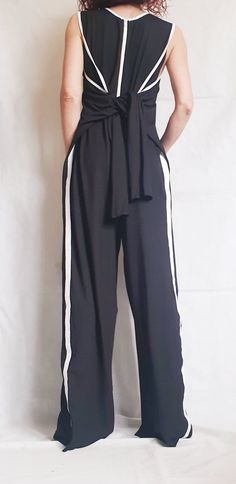 "Asymmetric long Jumpsuit/Harem Jumpsuit/Boho Jumpsuit/ Gothic Jumpsuit / Extravagant Wide Leg Overall/Steampunk Jumpsuit/Sleeveless Jumpsuit ❤️ Extravagant designs and high quality fabrics! ❤️ Materials & Care Cotton Hand wash at low temperatures. Do not machine dry. Do not iron. Do not dry clean! ❤️ Sizing We can make your piece from XS to 5XL! Everything in the shop can be also made according to your measures free of charge! ❤️ Shipping ✈ Ready to ship The time I need to prepare an order Fitted Summer Jumpsuits And Rompers Trousers, Fitted Summer Jumpsuits And Rompers, Full Length Jumpsuits And Rompers For Summer Nights, Sleeveless Jumpsuits And Rompers For Festivals, Bohemian Fitted Wide Leg Jumpsuits And Rompers, Summer Workwear Full-length Jumpsuits And Rompers, Full Length Summer Jumpsuits And Rompers For Work, Full-length Summer Jumpsuits For Work, Gothic Jumpsuit