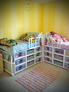 a bedroom with yellow walls and white shelving units filled with children's toys