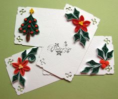 three christmas cards with holly and poinsettis on them