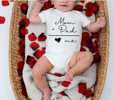 This mom and dad is me bodysuit is the perfect gift for expecting parents or as a welcome gift for the new arrival ♥ PRODUCTION TIME: 1-5 days (Usually 2-3 days) ♥ SHIPPING TIME: 2-5 days (Usually 3 days) ♥PRODUCT DESCRIPTION: Rabbit Skins 100% Combed ringspun cotton (fiber content may vary for different colors) Light fabric (4.5 oz/yd² (153 g/m Tear away label * For T-shirt Sizes Please refer to the Listing Image. ♥ CARE INSTRUCTIONS: Machine wash: warm (max 40C or 105F); Non-chlorine: bleach a Father's Day Gift Onesie With Letter Print, Father's Day Family Matching Onesie, Family Matching Onesie With Letter Print As Gift, Family Matching Letter Print Onesie Gift, Family Matching Onesie With Letter Print, Mother's Day White Letter Print Bodysuit, Short Sleeve Onesie As A Mother's Day Gift, Cute Bodysuit For Mother's Day Gift, White Onesie For Mother's Day Gift