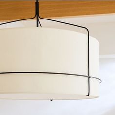 a light fixture hanging from the ceiling in a room