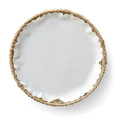 an empty white plate with gold trimmings on the rim and bottom, against a white background