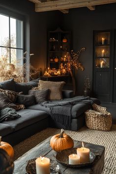 a living room filled with lots of furniture and candles