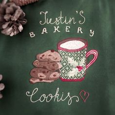 there is a green jacket with cookies and a mug