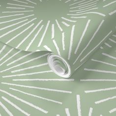 a beige wallpaper with white lines on it and a roll of paper next to it