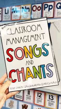 someone holding up a sign that says classroom management songs and shants