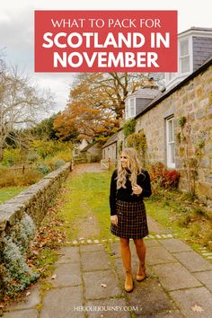 a woman standing in front of a house with text overlay that reads what to pack for scotland in november