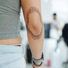 a woman with a tattoo on her arm