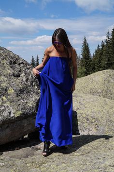 "We love the laid-back feel of this unique dress. Cut from beautifully royal blue polyviscose fabric that feels effortless to wear. Cut for a loose fit, with lovely and romantic off shoulder top. This flattering maxi design has unusual design,that gives gently flared silhouette. Pair yours with sneakers at the weekend or with flats to reach smart business outfit, dress is designed with a unique maxi length for effortless comfortability. MATERIALS × poly-viscose ---------------------------------- Blue Maxi Sundress For Beachwear, Sleeveless Blue Maxi Dress For Beach, Blue Sleeveless Maxi Dress For Beach Party, Sleeveless Blue Maxi Dress For Beach Party, Blue Bohemian Sundress For Beach Party, Blue Flowy Maxi Dress For Festival, Blue Beachwear Maxi Dress For Summer, Royal Blue Maxi Dress For Summer, Blue Summer Dress For Beach Party