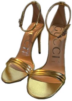 Gucci Luxury Formal Sandals, Chic Gold Gucci Heels, Elegant Gold Gucci Heels, Evening Gold Gucci Sandals, Gold Gucci Evening Sandals, Gucci Gold Evening Sandals, Gucci Gold Designer Sandals, Designer Gucci Gold Sandals, Gucci Gold Leather Sandals