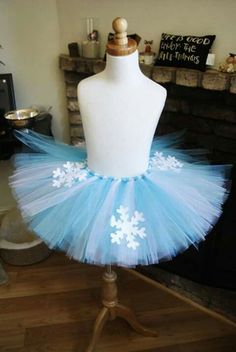 a mannequin wearing a blue and white snowflake tutu