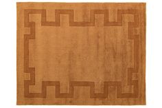 a brown rug with an intricate design on it