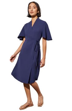 A wrap waistline accentuates your figure in a butterfly-sleeve dress crafted from airy crêpe de Chine. 38" length Surplice V-neck Short sleeves 100% polyester Machine or hand wash, dry flat Imported Formal Short Sleeve Faux Wrap Dress, Summer Wrap Dress With Draped Sleeves, Fitted Belted Dress With Flutter Sleeves, Chic Wrap Dress With Kimono Sleeves For Evening, Chic Evening Wrap Dress With Kimono Sleeves, Flowy Wrap Dress, Elegant Style, Chic Flutter Sleeve Dress With Tie Waist, Pre-draped V-neck Dress For Work, Chic Wrap Dress With Draped Sleeves