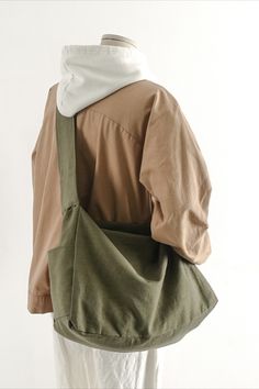 the back of a woman's jacket with an apron on it