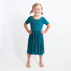 Cut from soft, stretchy bamboo fabric, this twirl dress features a full skirt so your toddler can spin in style. The classic design of the dress can easily be dressed up or down, making it the perfect everyday outfit. 97% Rayon made from Bamboo, 3% Spandex 240 gsm creates a flattering drape Ballerina neckline Solid Stretch Cotton Dresses, Casual Dress With Gathered Skirt, Spring Dresses For Playdate, Fitted Solid Dress With Gathered Skirt, Casual Stretch Twirl Dress For Playtime, Flowy Casual Twirl Dress For Playtime, Comfortable Casual Twirl Dress For Playtime, Casual Flowy Twirl Dress For Playtime, Playful Short Sleeve Stretch Twirl Dress